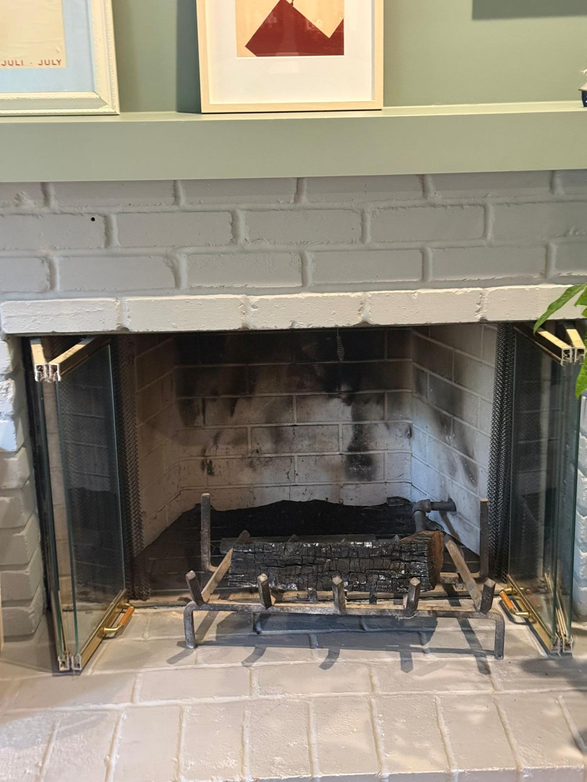 Dirty fireplace chimney with heavy soot buildup before professional chimney cleaning