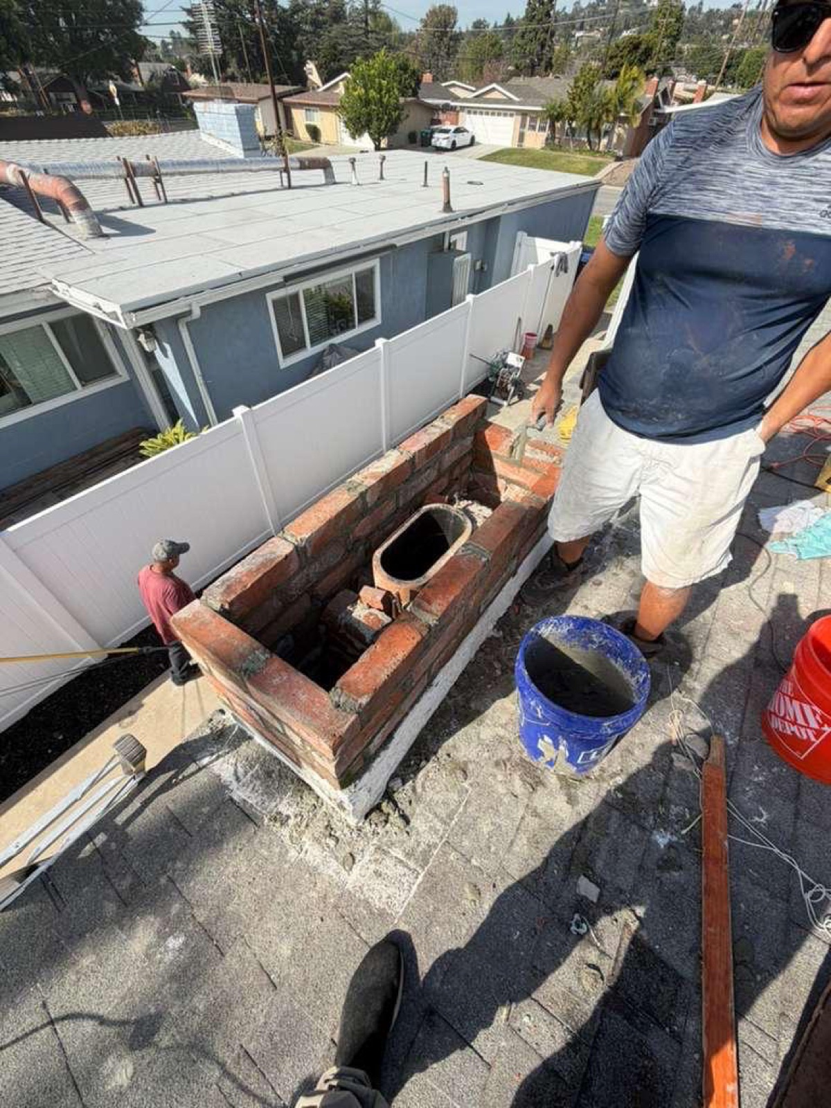 California chimney before rebuild by California Airduct Pros — damaged top with exposed flue and deteriorated mortar requiring full reconstruction