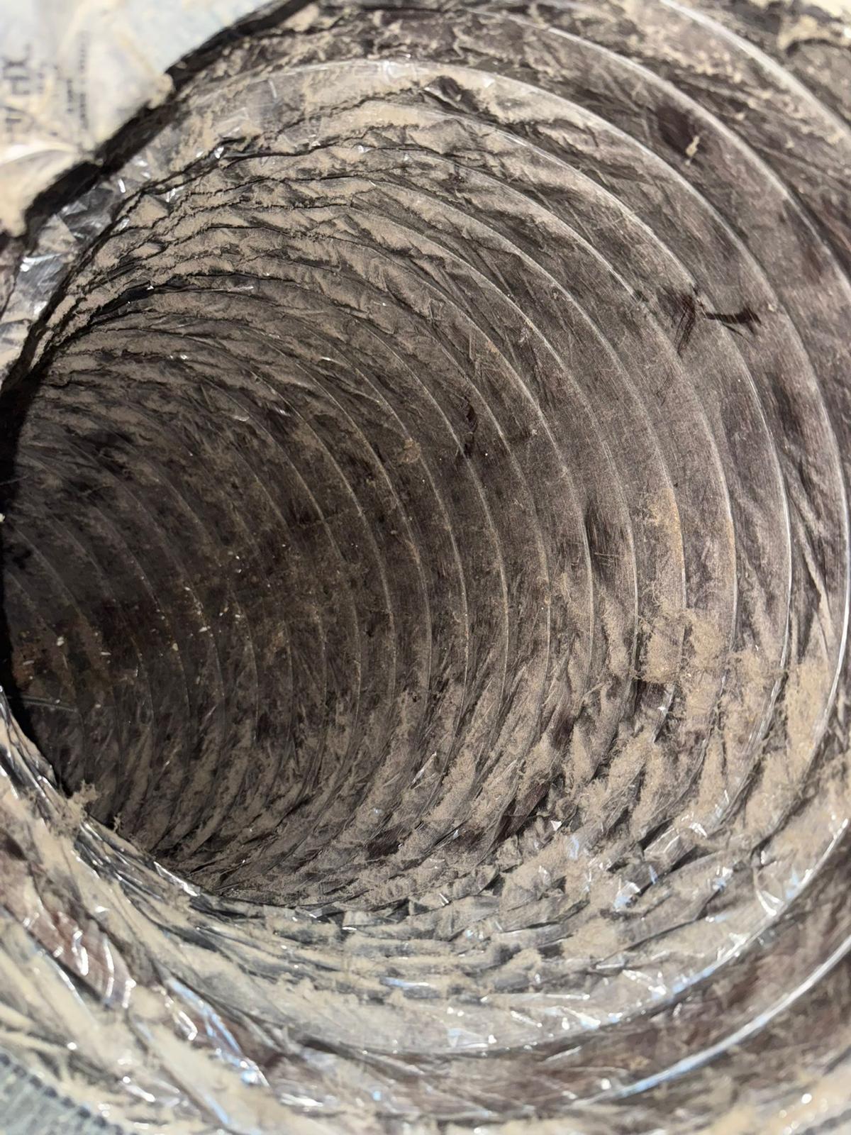 Insulated ductwork running through an attic space
