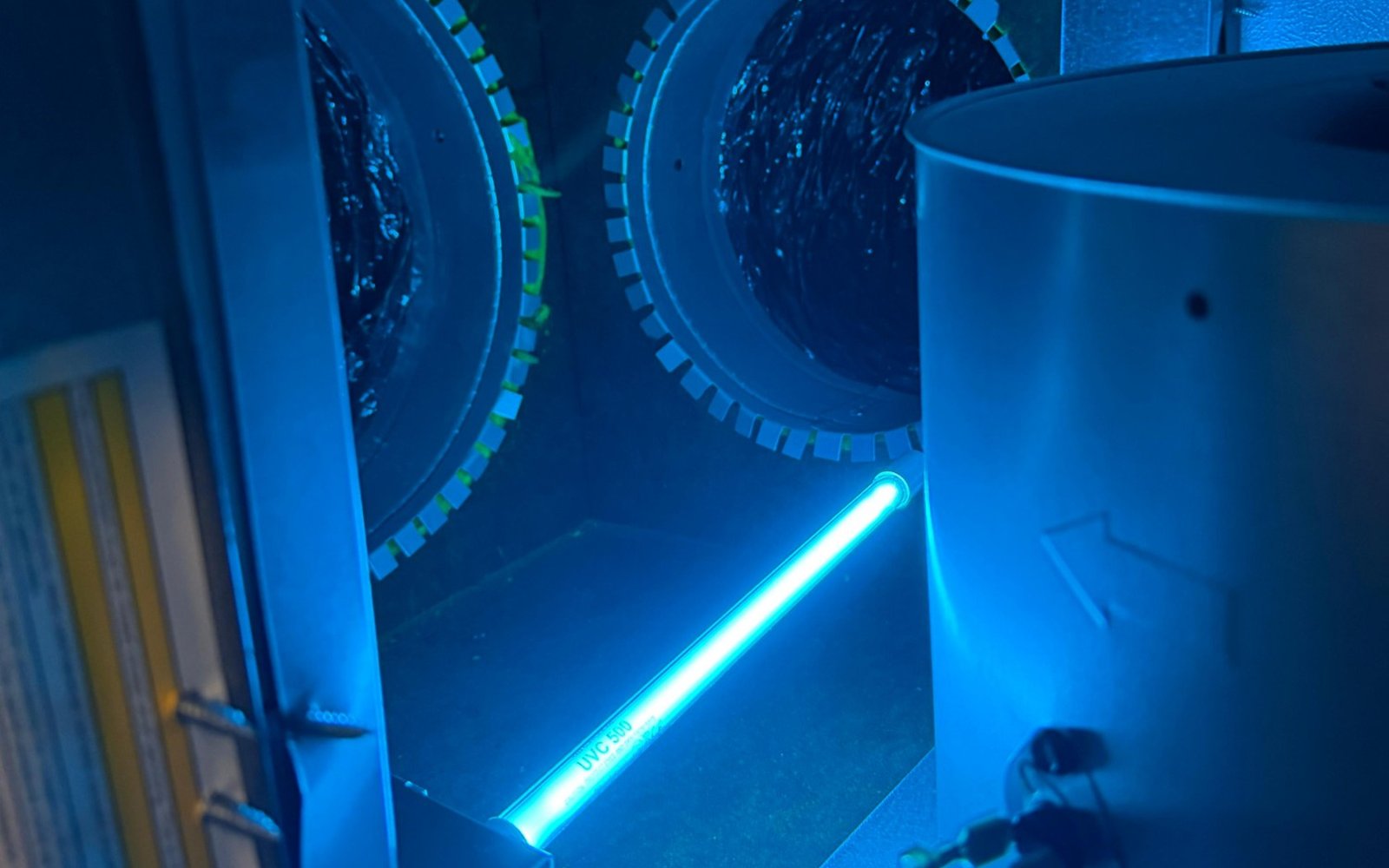 UVC 500 sterilizing bulb installed inside a California HVAC cabinet by California Airduct Pros — illuminating the coil and ductwork where 99.9% of bacteria, mold spores, and viruses are killed continuously